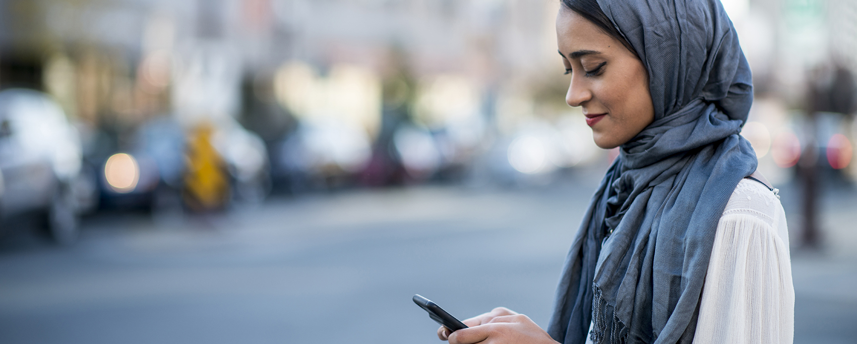 Muslim woman on smartphone