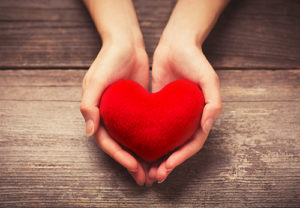 A heart in a woman's hands