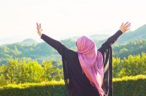 Muslim woman celebrating