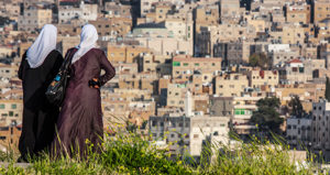 Two women looking towards the city, Amman, Jordan